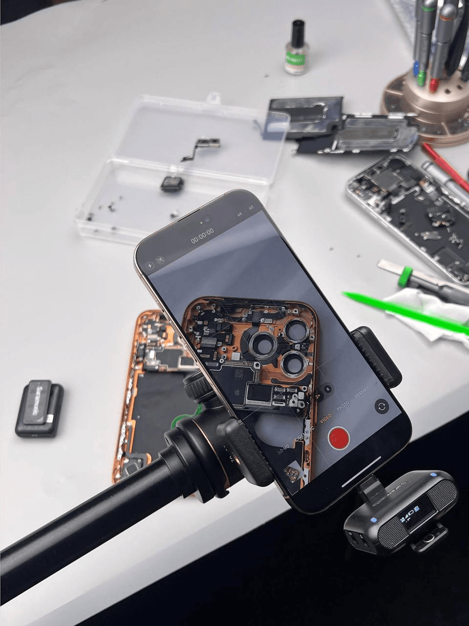 Technician repairing a smartphone